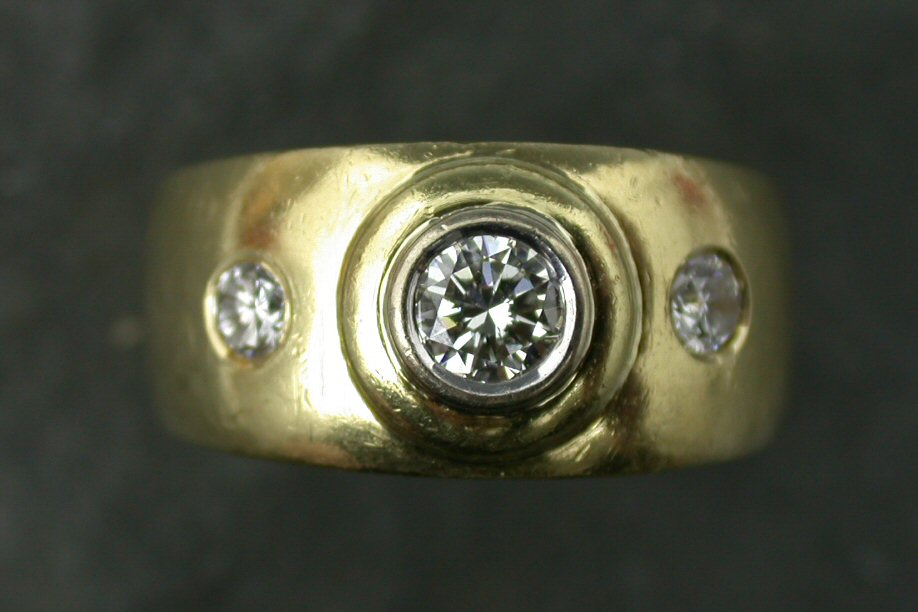 A diamond three stone ring,