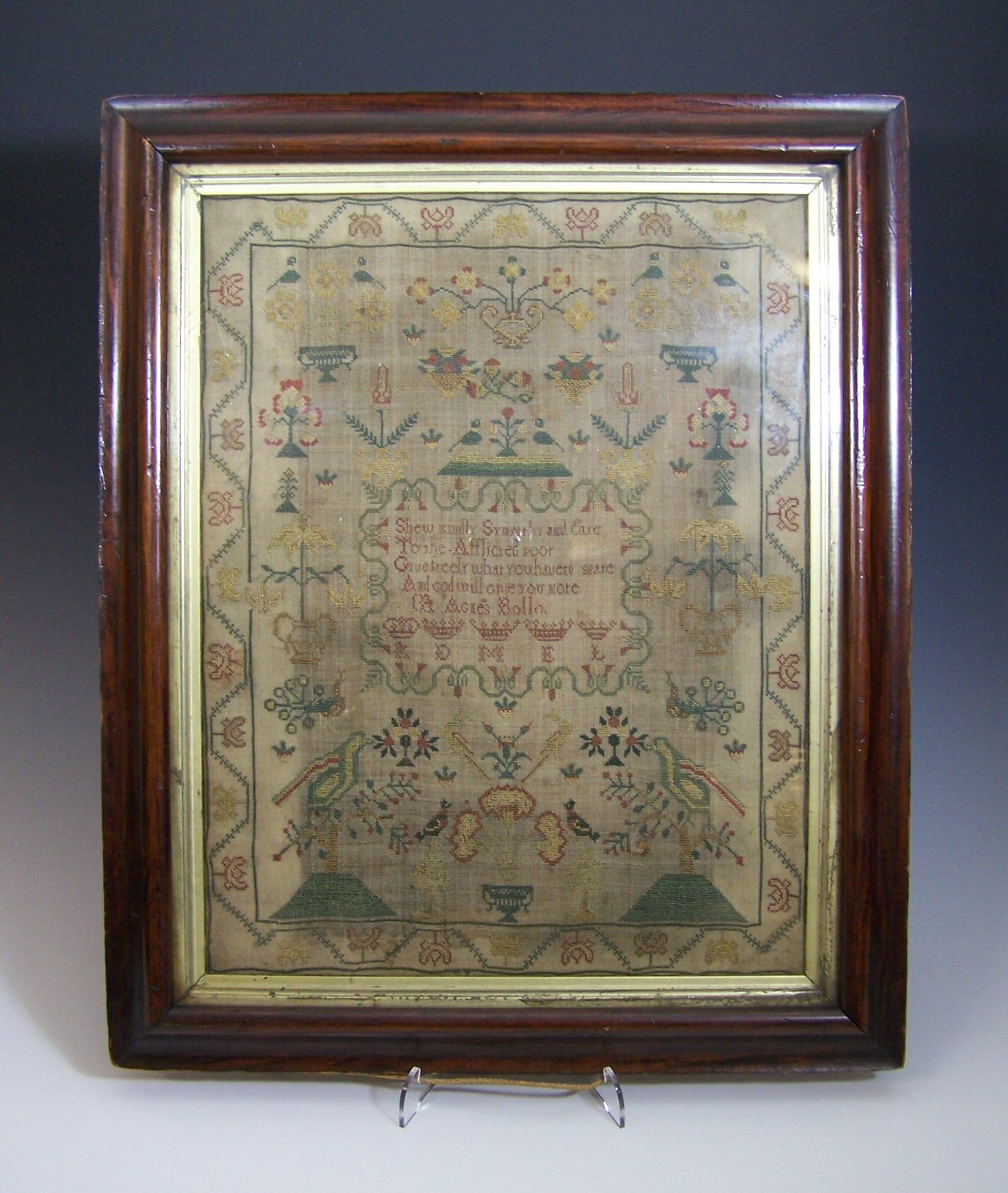 A 19th century framed sampler by Agnes Rollo,