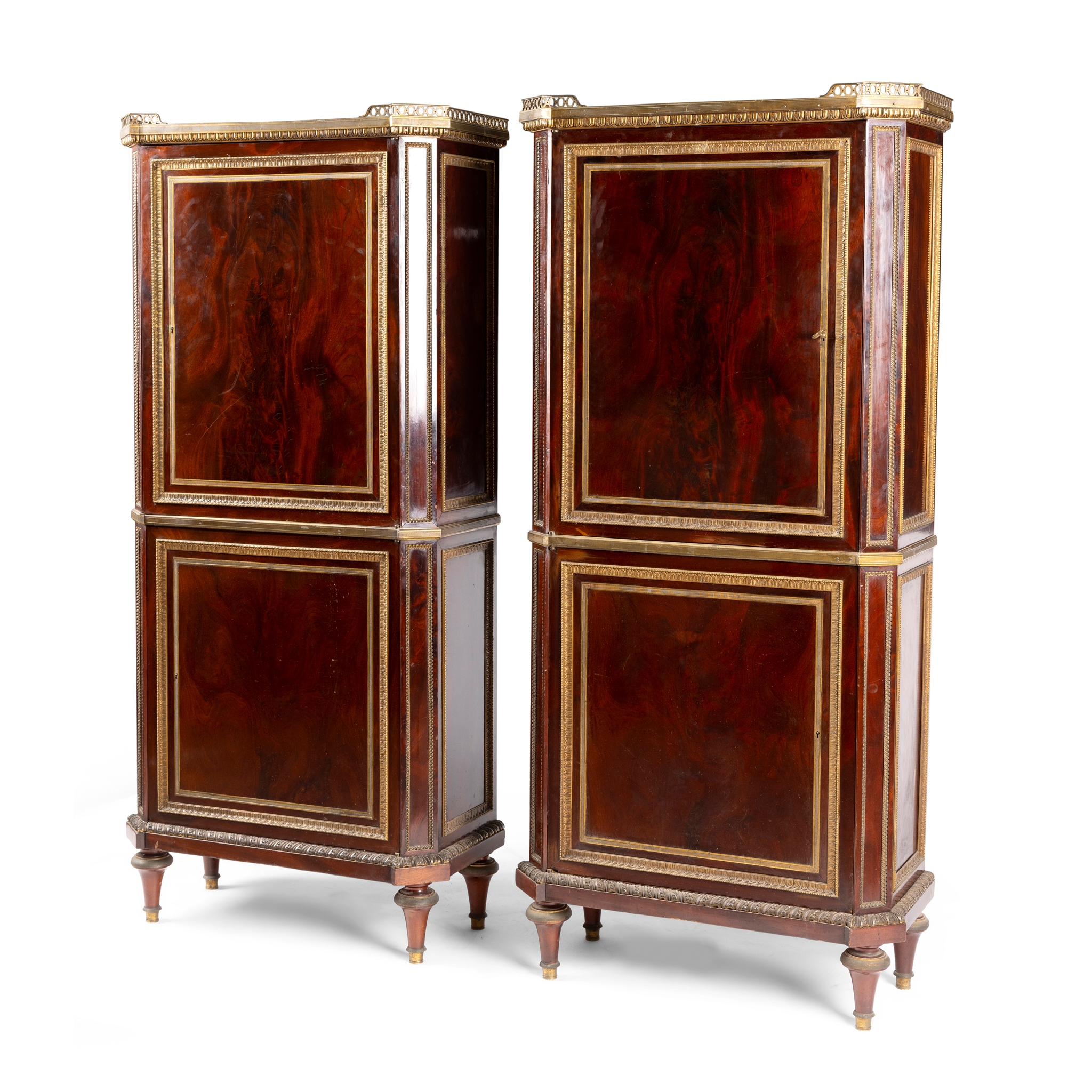 A PAIR OF FRENCH MAHOGANY AND GILT METAL MOUNTED SIDE CABINETS