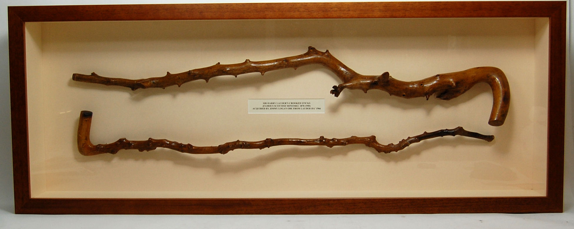 Two crooked briar walking sticks, once the property of Sir Harry Lauder