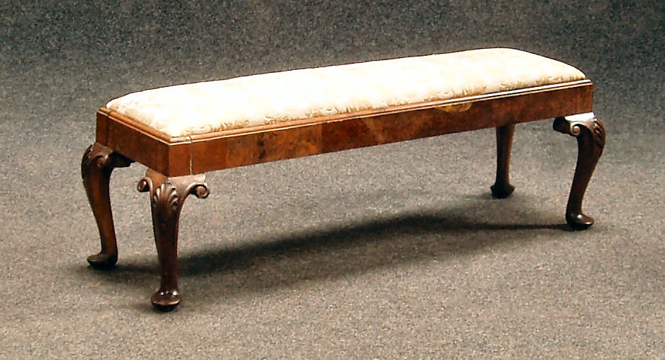 A 19th century walnut long stool
