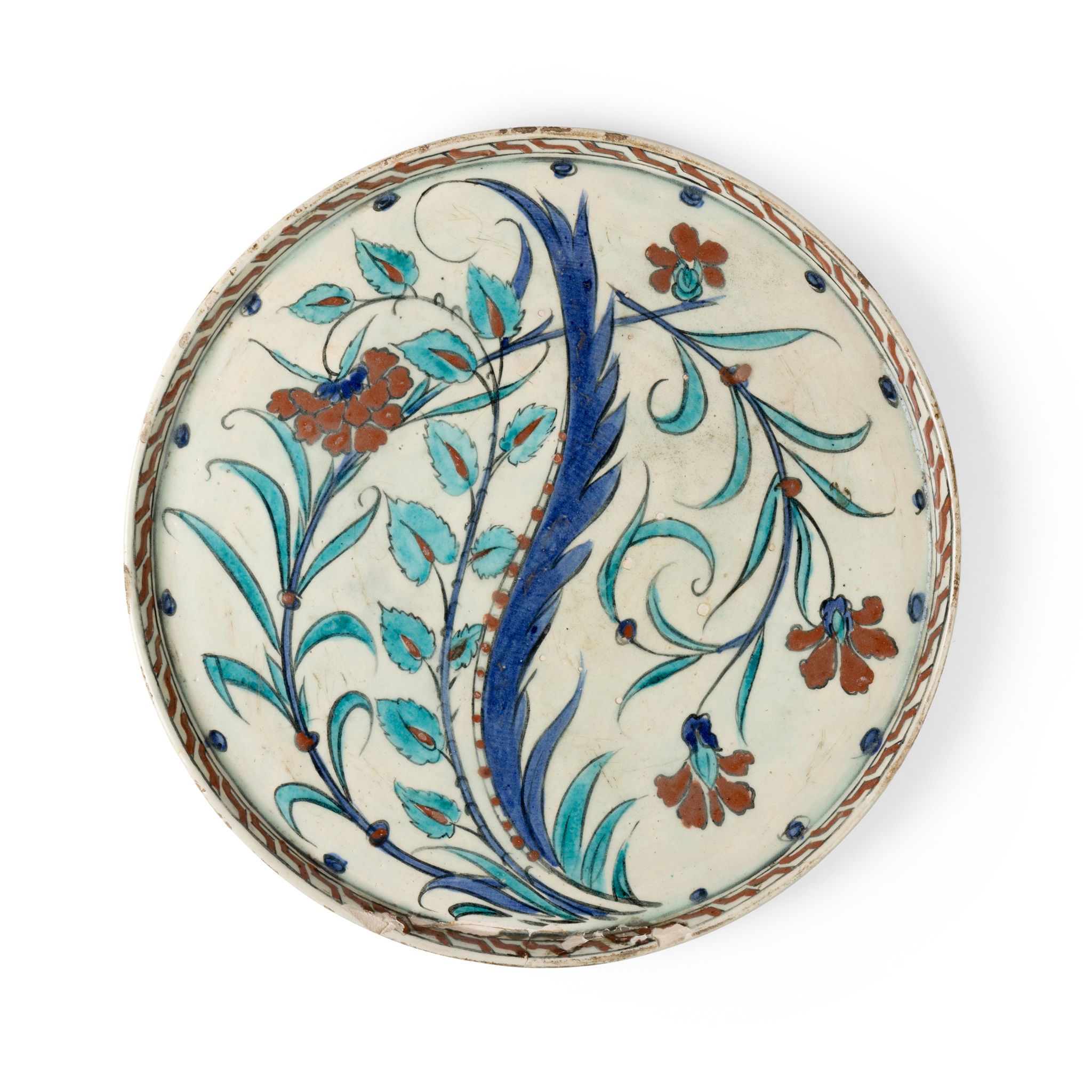 IZNIK-STYLE RIMLESS POTTERY DISH WITH SAZ LEAF