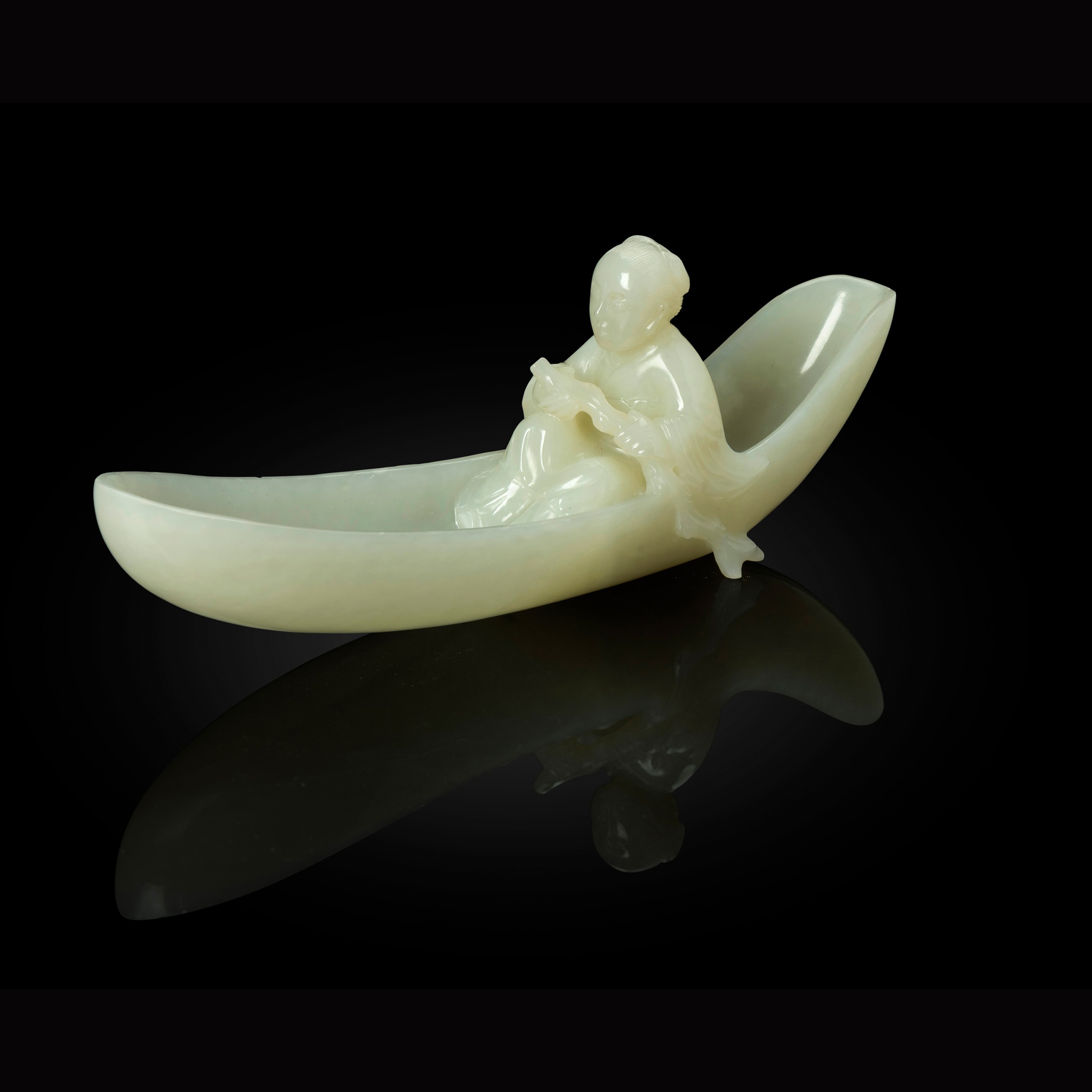 WHITE JADE CARVING OF A SAMPAN AND FISHERMAN