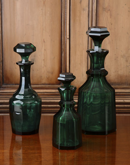 A 19th century green glass faceted decanter and stopper