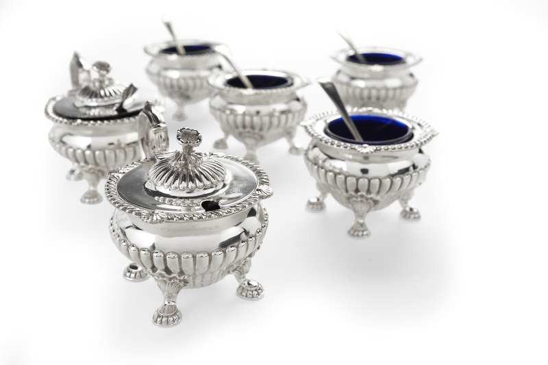 A six piece silver condiment set