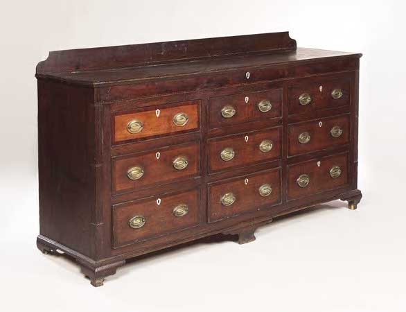A George III oak and mahogany crossbanded dresser base,