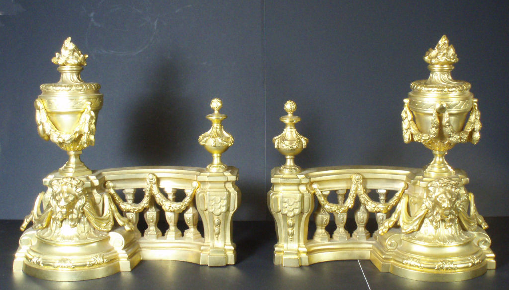 A Louis XV style gilt bronze chenet and fender