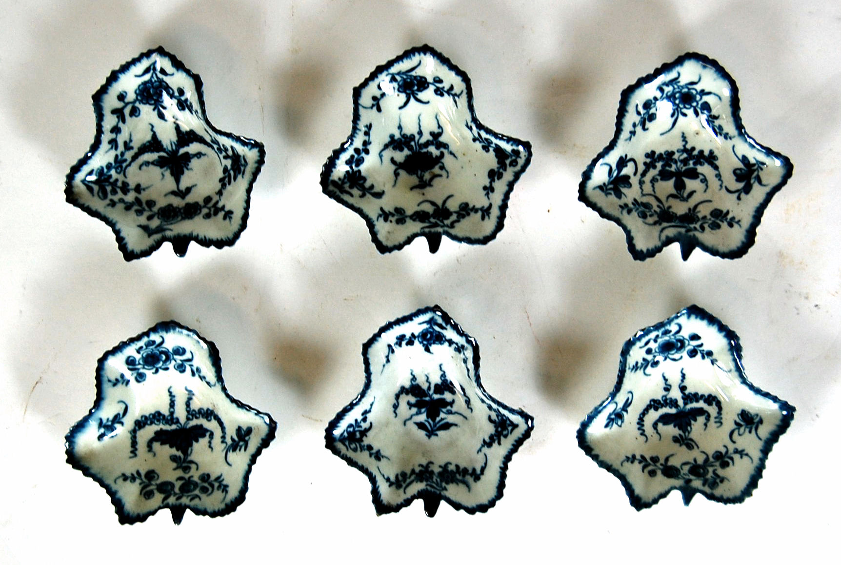 A matched set of six first period Worcester leaf shaped pickle dishes