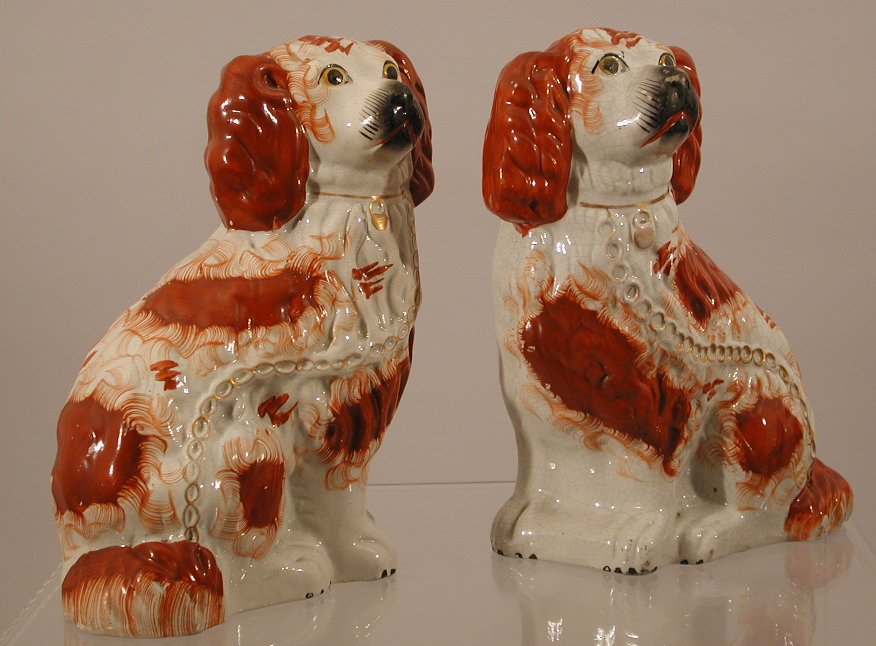 A pair of Staffordshire figures of seated spaniels
