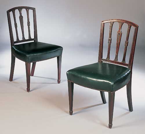 A set of seven George III mahogany dining chairs