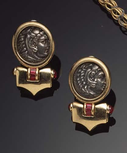 A pair of mounted coin earrings also set with rubies,