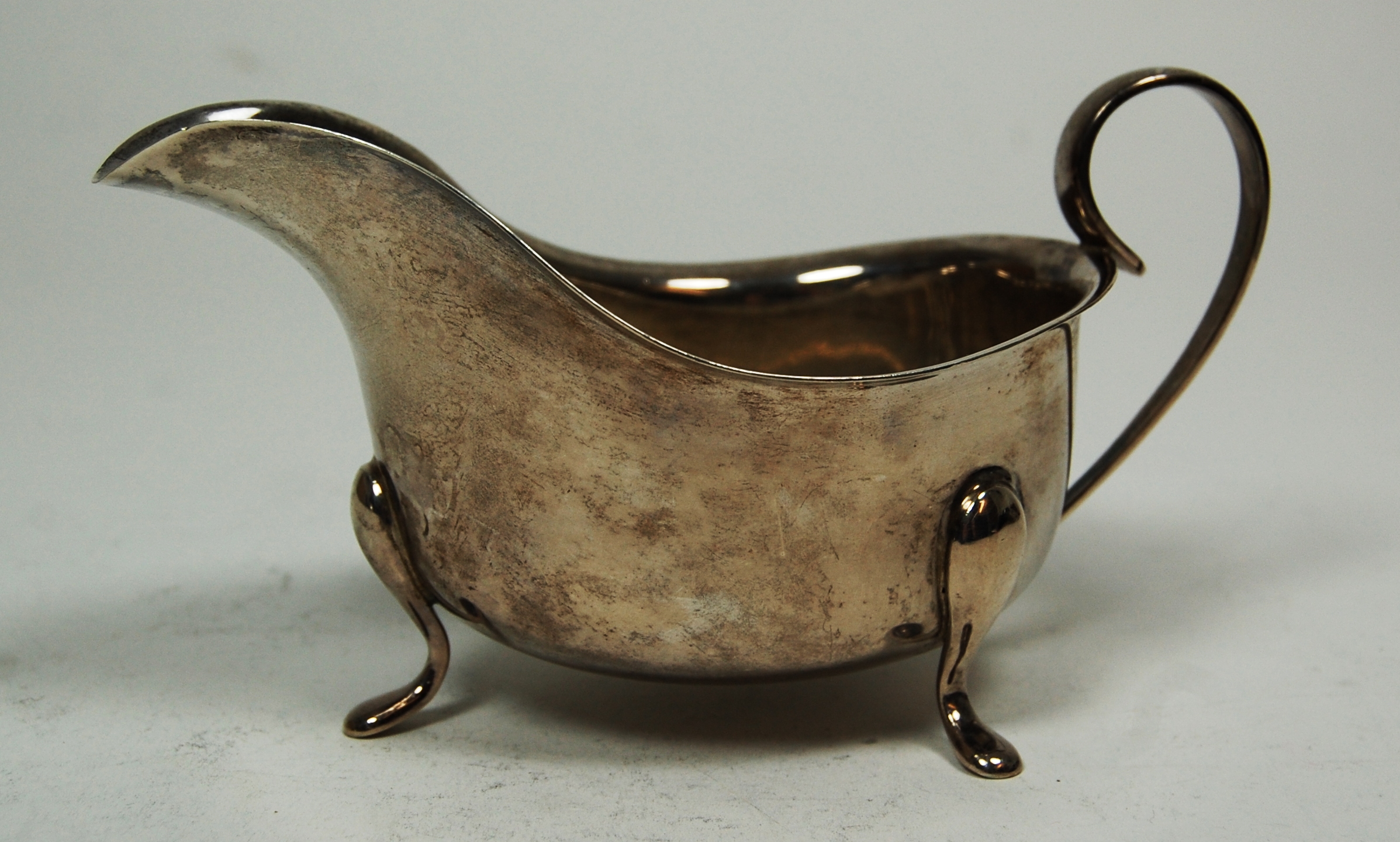 An Edwardian sugar bowl and cream jug