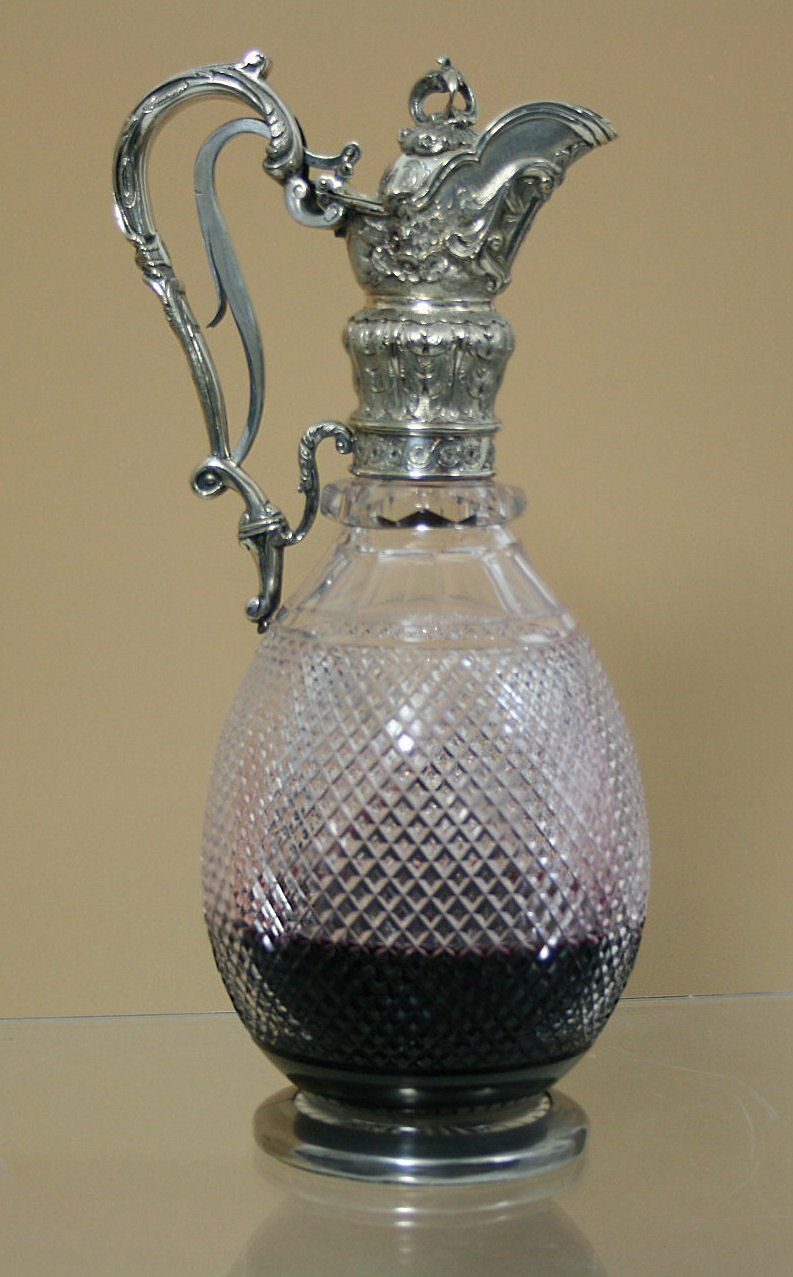 A Victorian claret jug with silver plated mounts