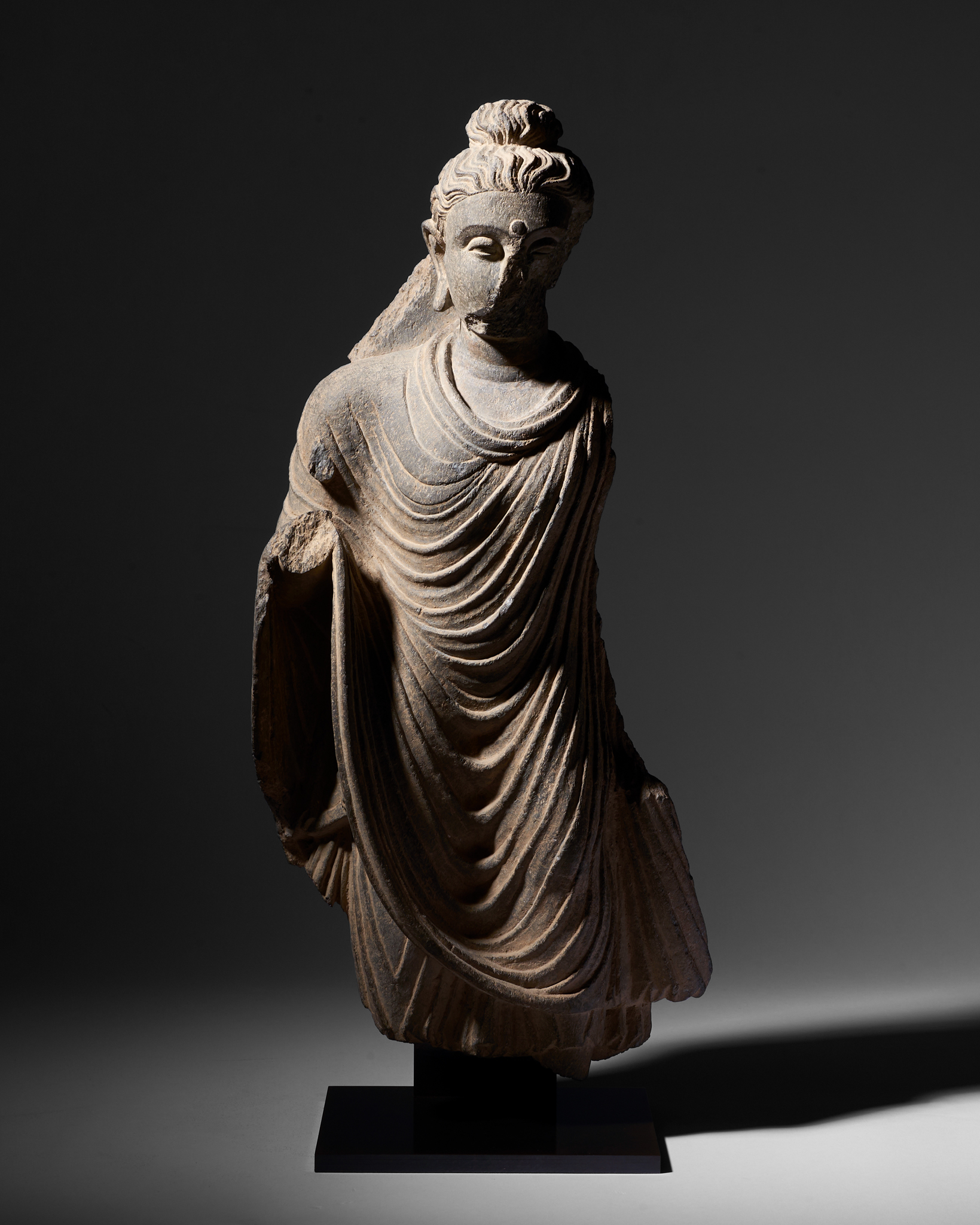 A GREY SCHIST FIGURE OF A STANDING BUDDHA