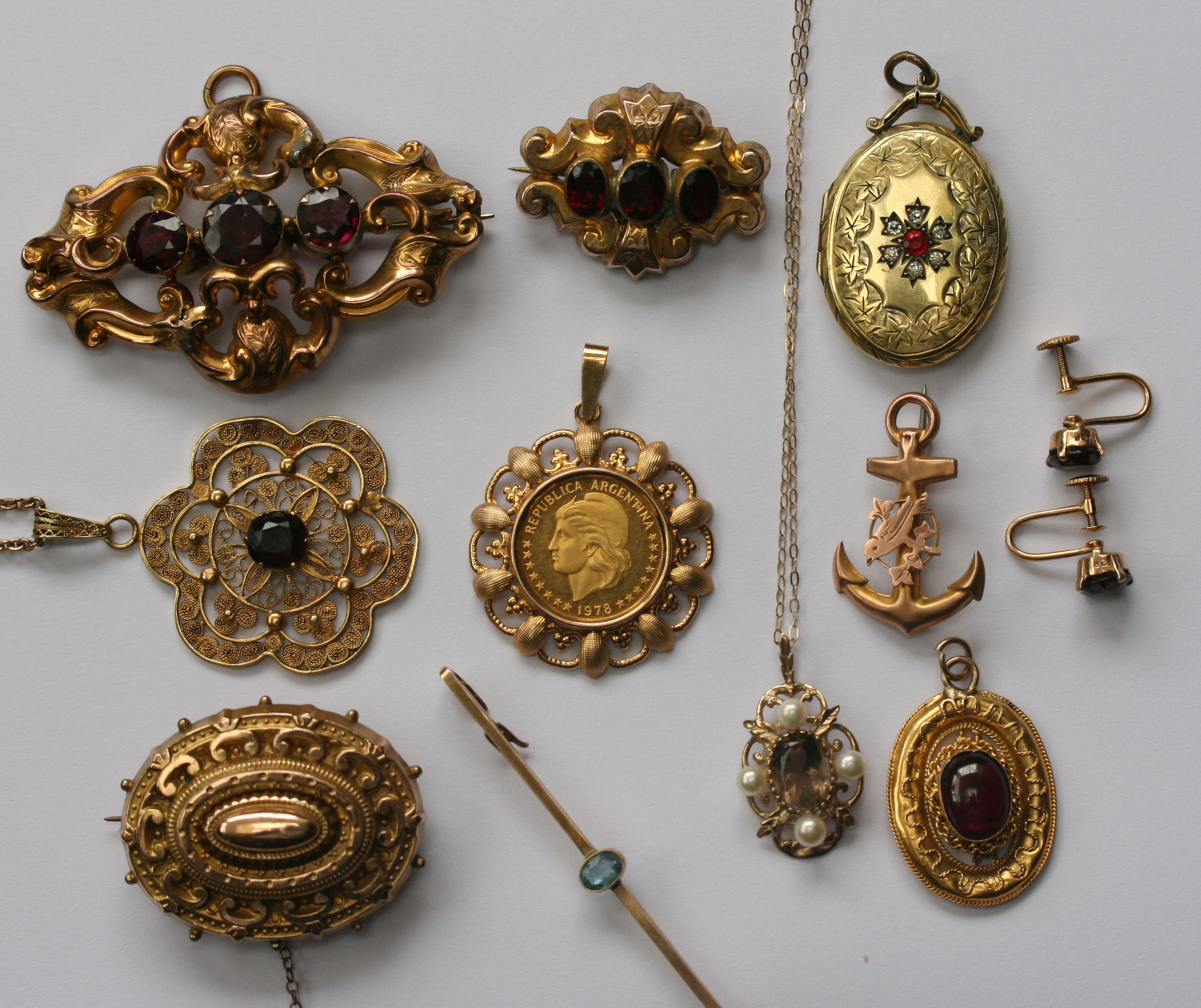 A group of various Victorian gold and other brooches and pendants