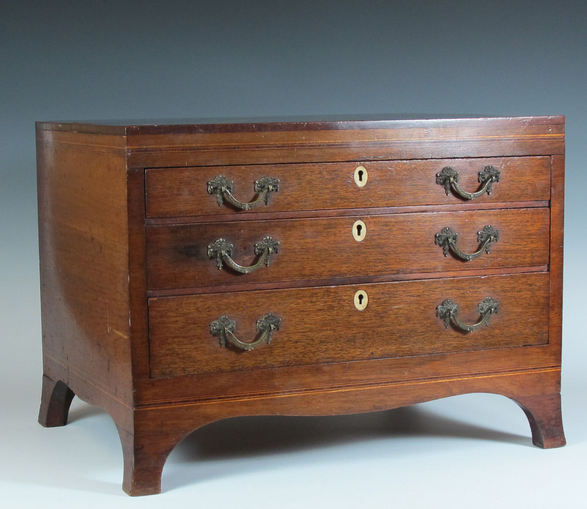 A 19th century mahogany miniature chest