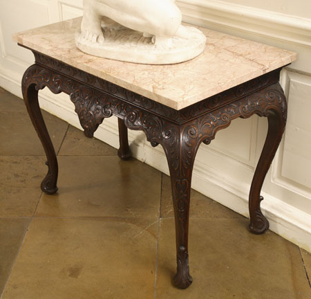 A marble topped mahogany side table
