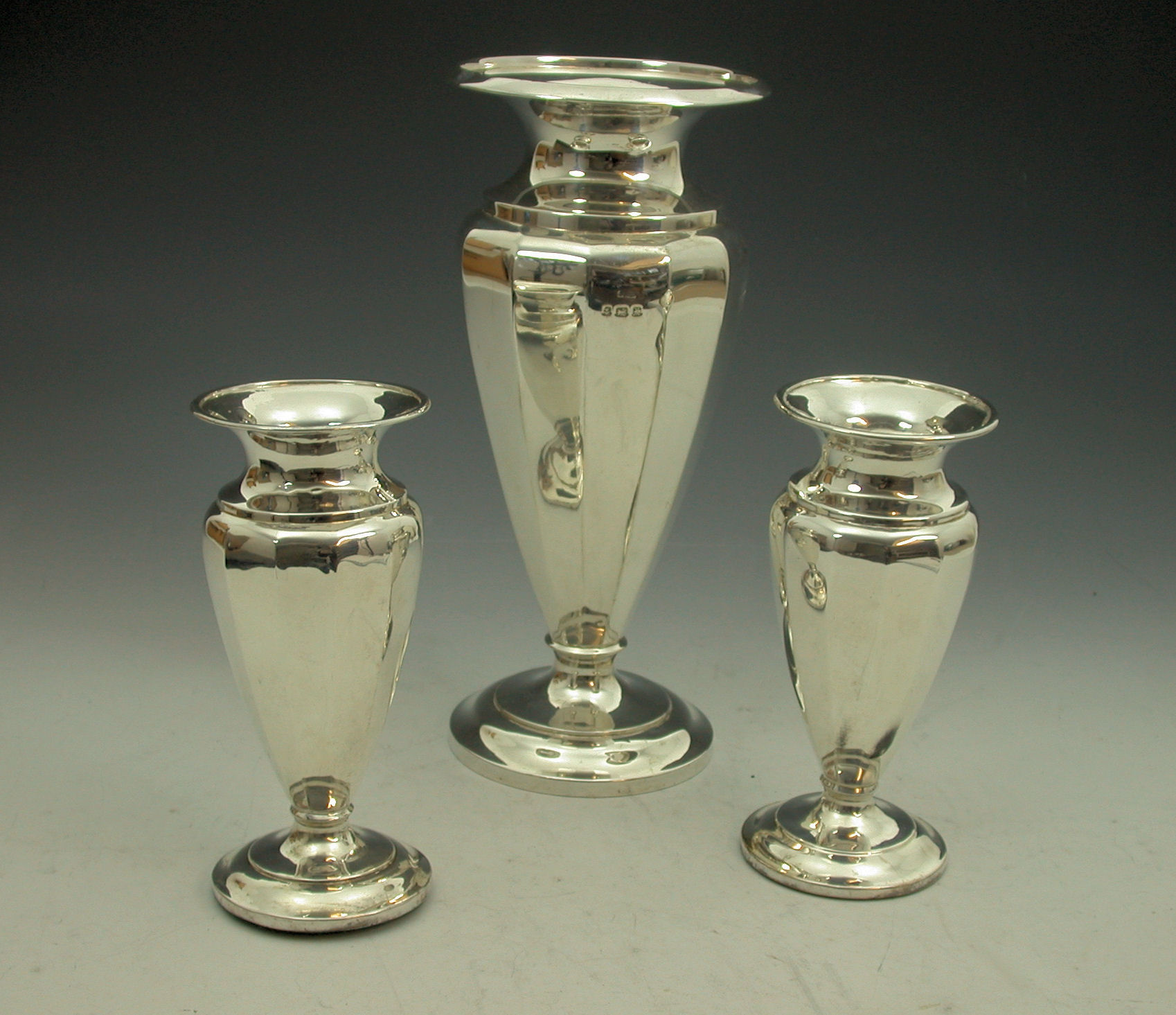 A suite of three vases,