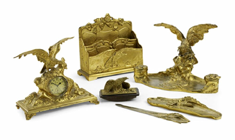 A French late 19th/early 20th gilt bronze desk set