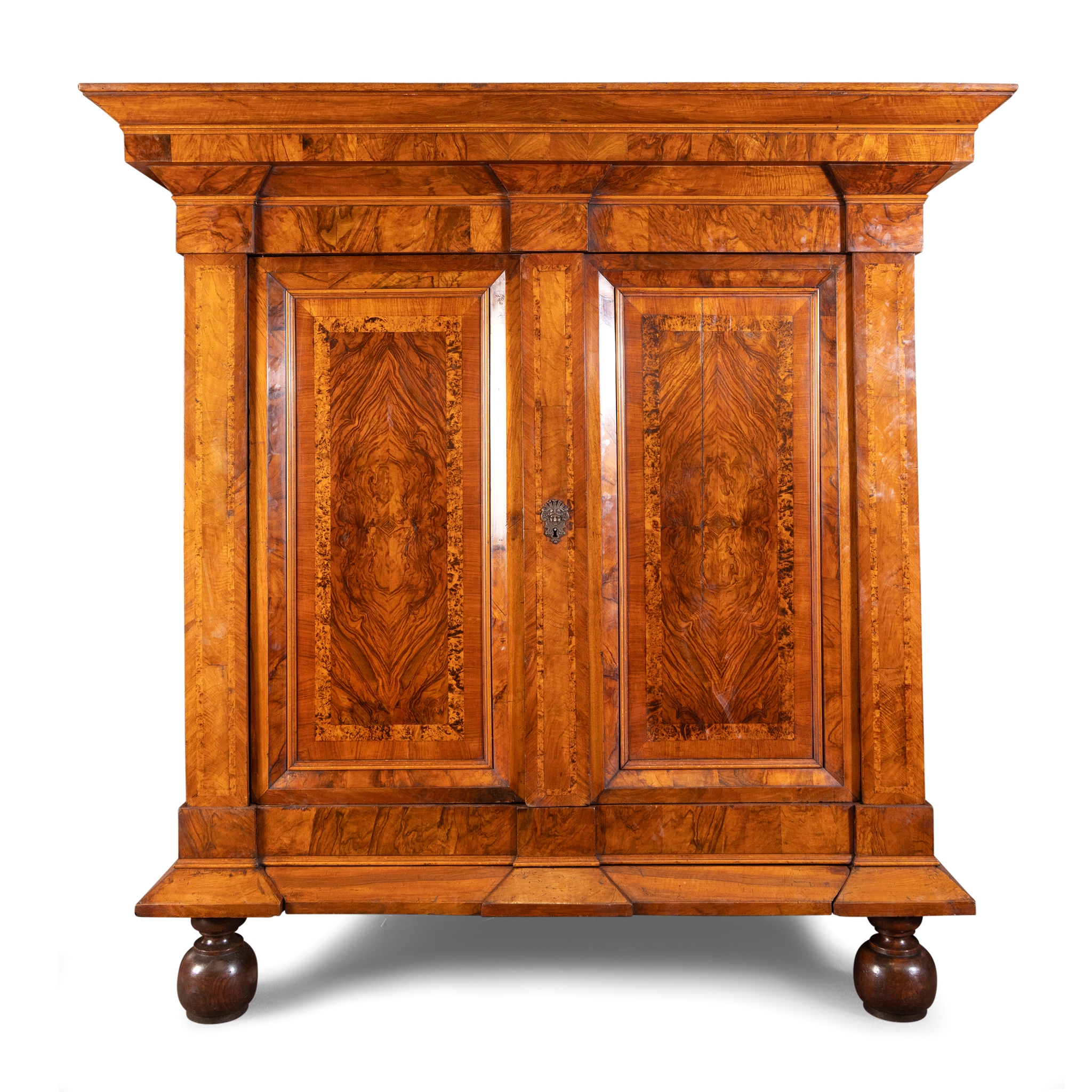A CONTINENTAL WALNUT AND BURR WALNUT CROSSBANDED ARMOIRE