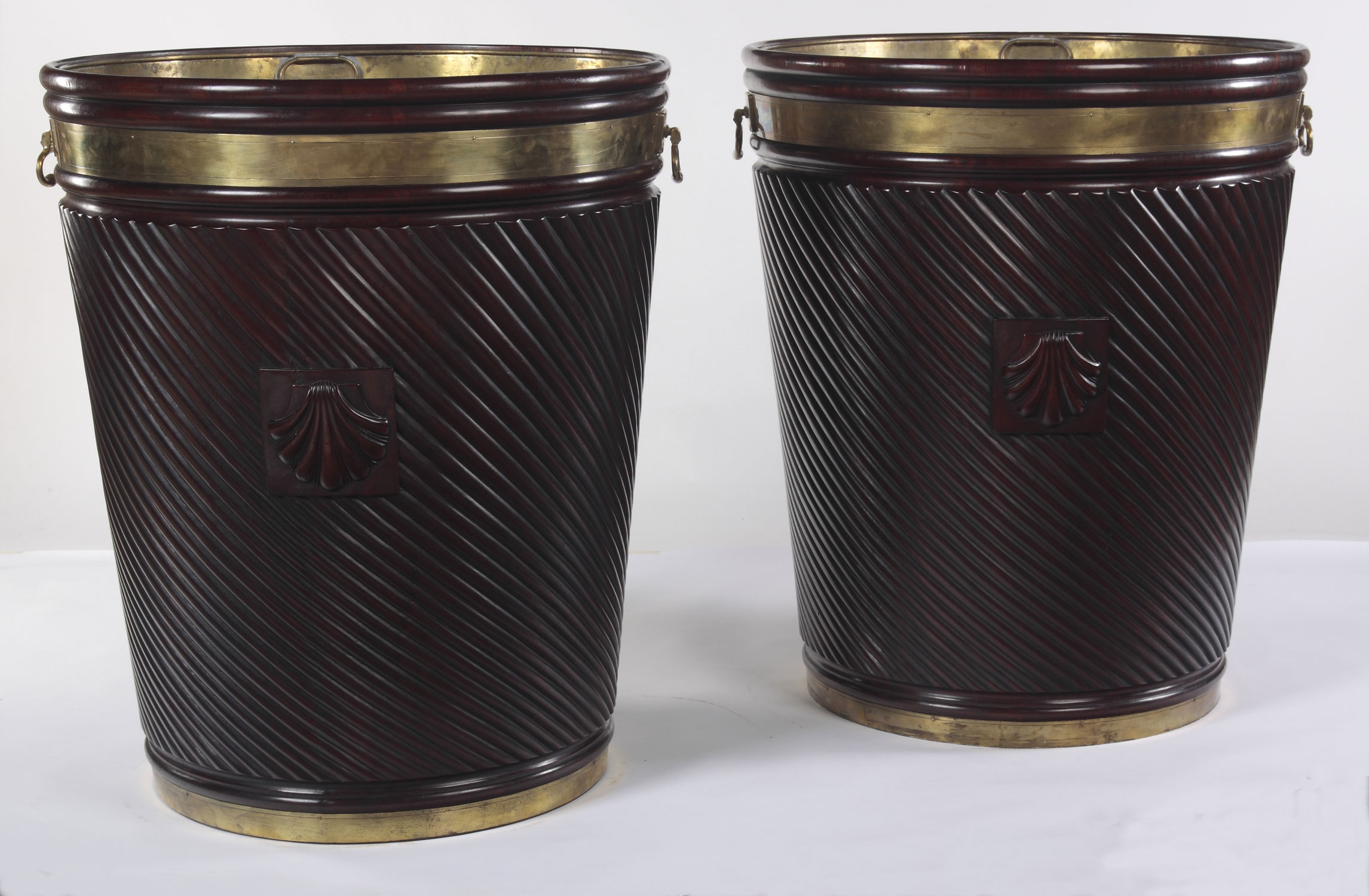 A pair of massive Irish mahogany and brass bound peat buckets