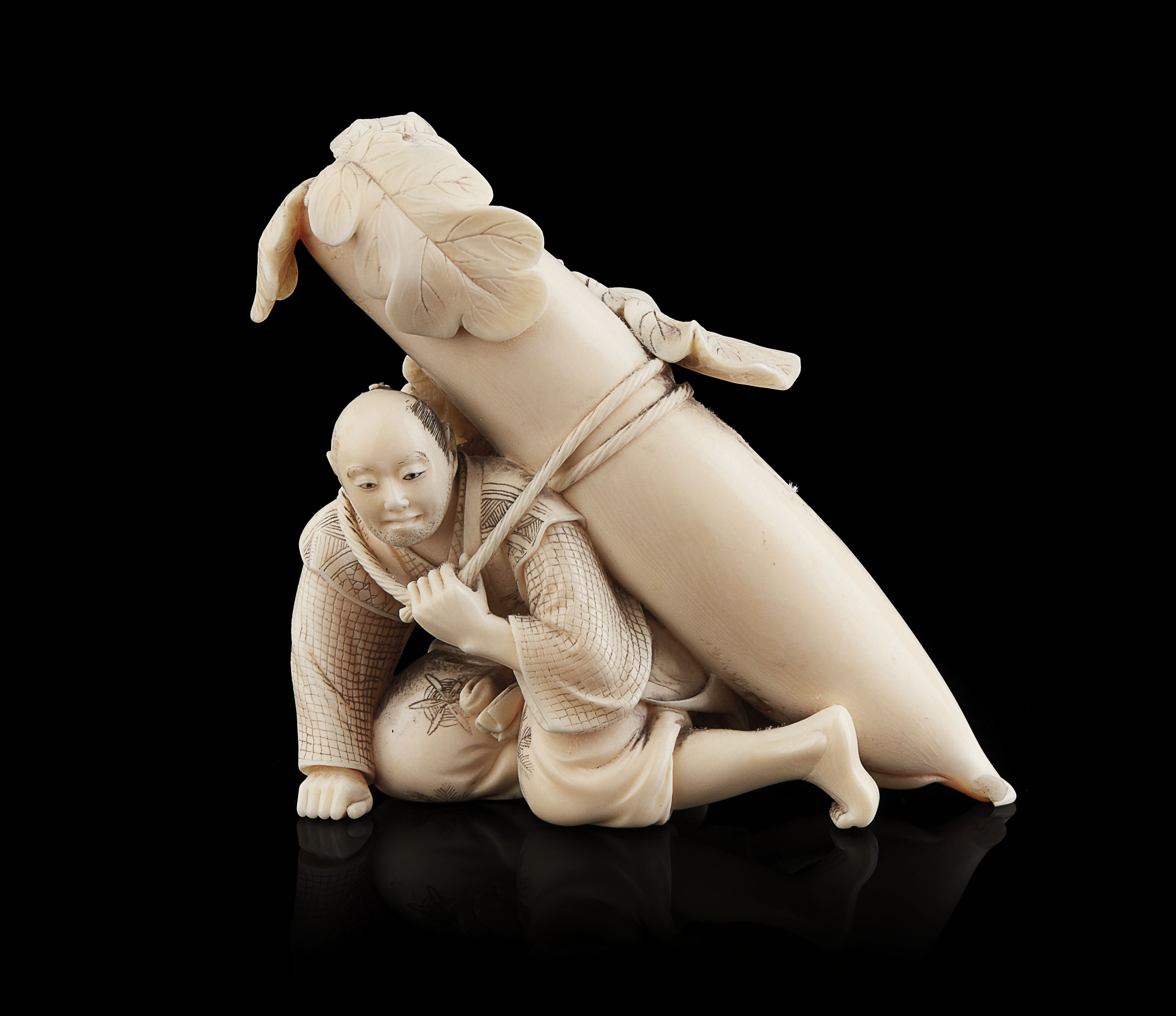 CARVED IVORY OKIMONO OF A FARMER WITH RADISH