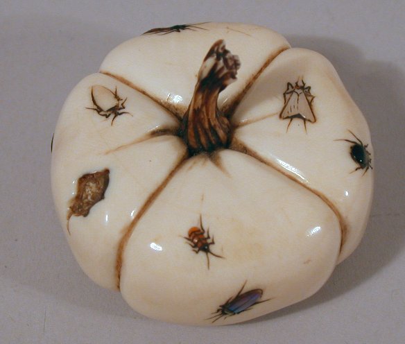 A Japanese carved ivory shibyama decorated flattened gourd