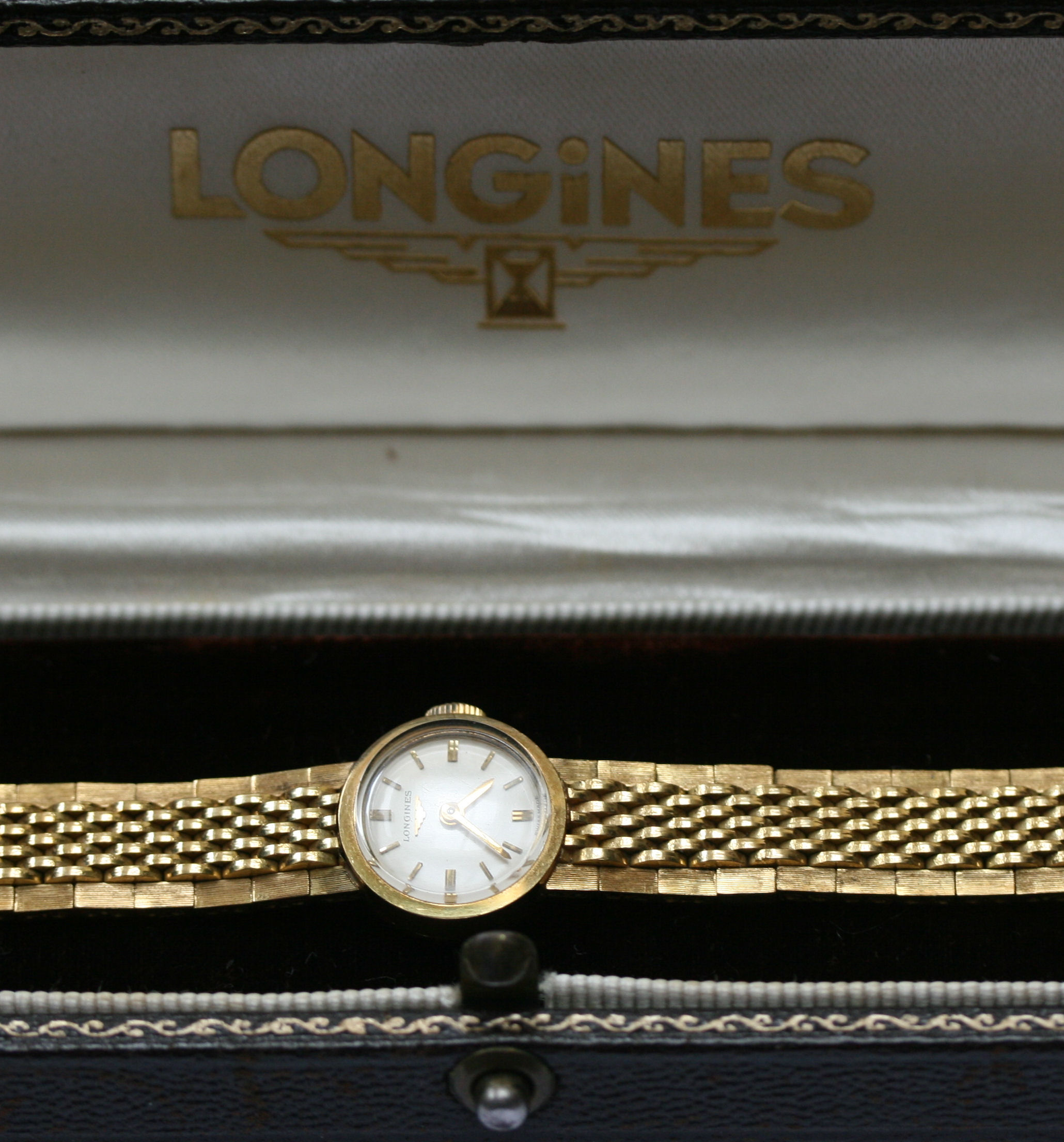 Longines - a lady's 18ct gold wrist watch