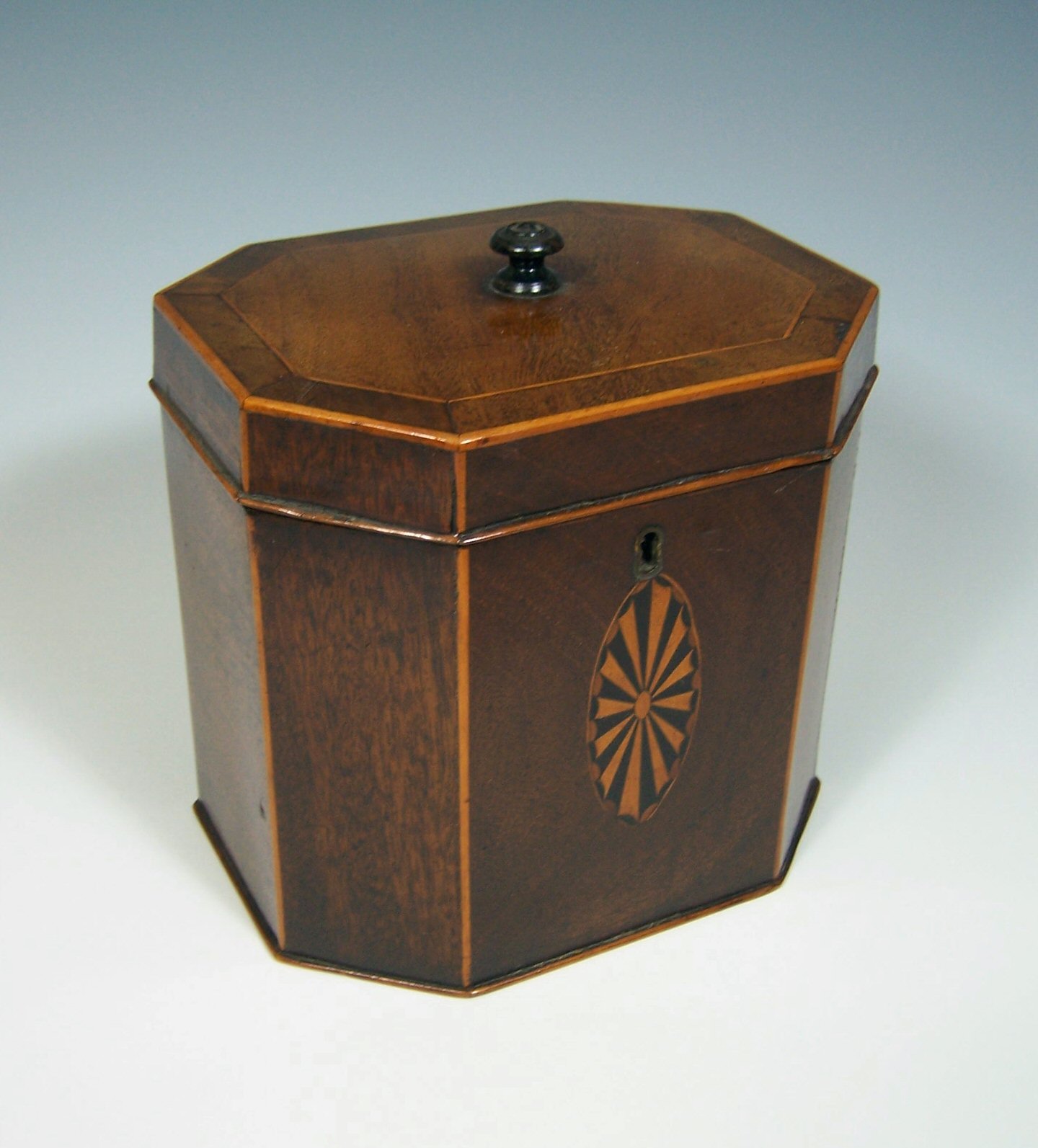 A George III mahogany octagonal tea caddy,