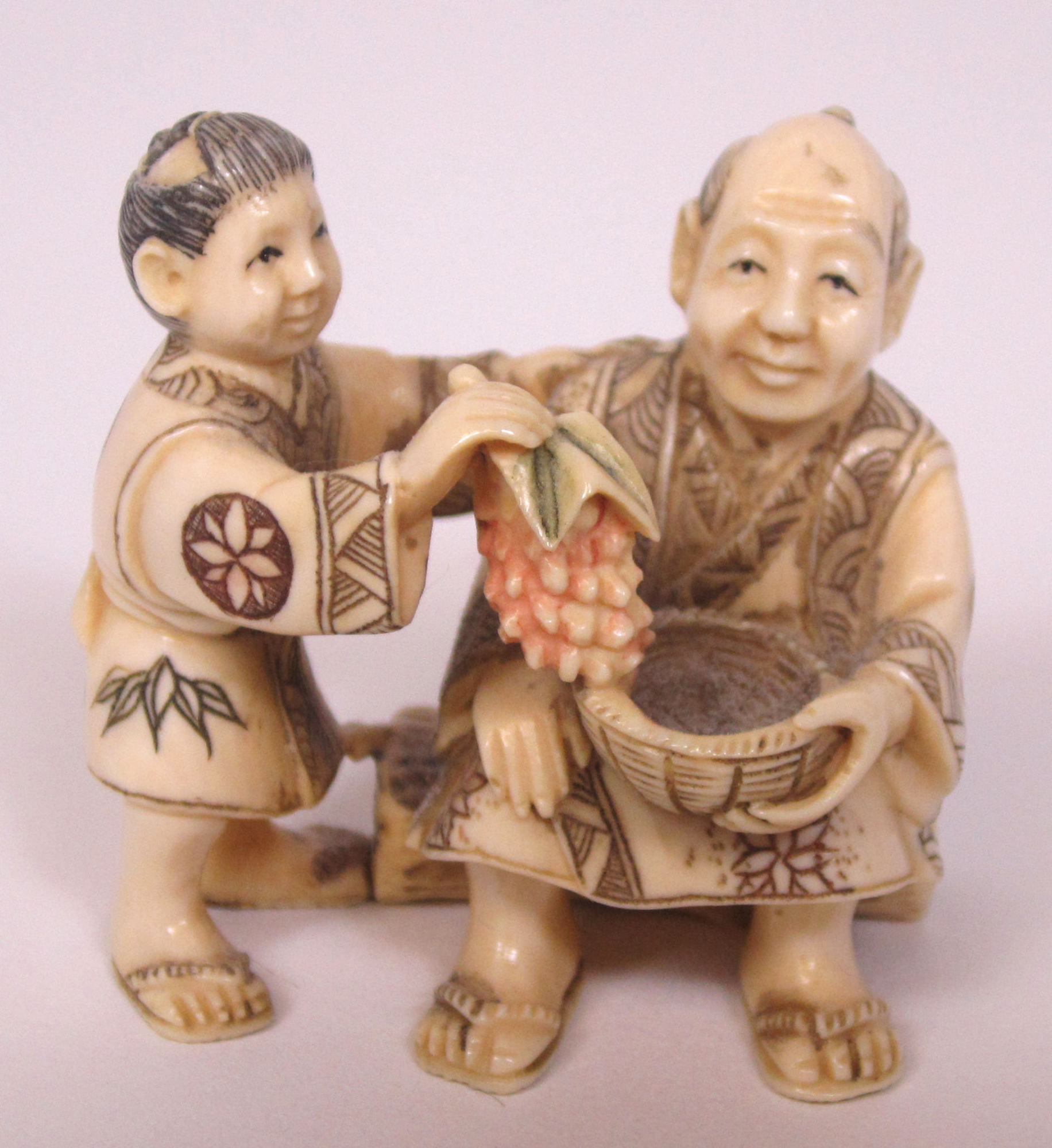 THREE JAPANESE CARVED IVORY NETSUKES