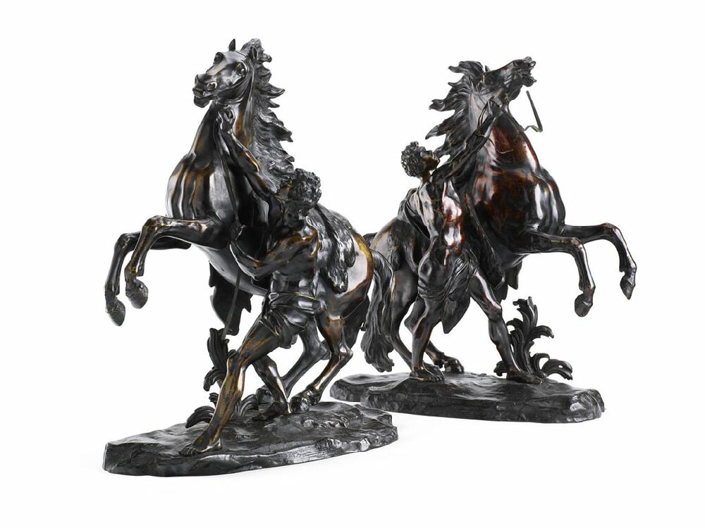 A pair of large bronze Marly horses