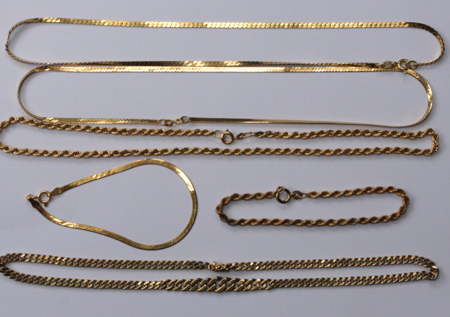A group of various 9ct gold neck chains
