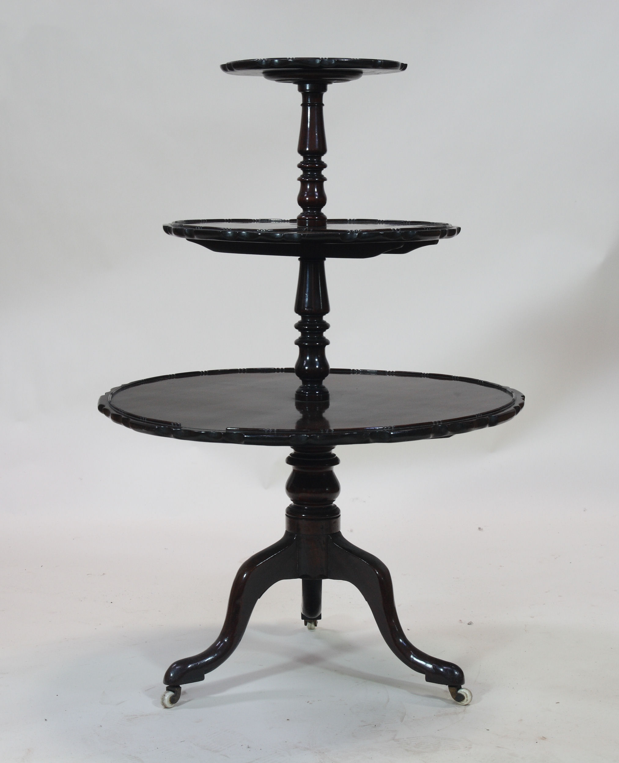 A George III style mahogany three tier dumb waiter
