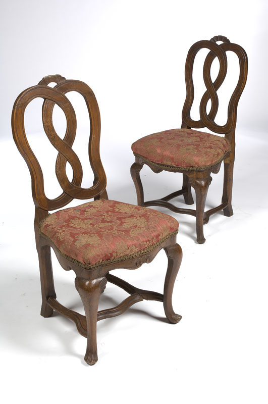 A set of six French country walnut dining chairs In the Louis XV style