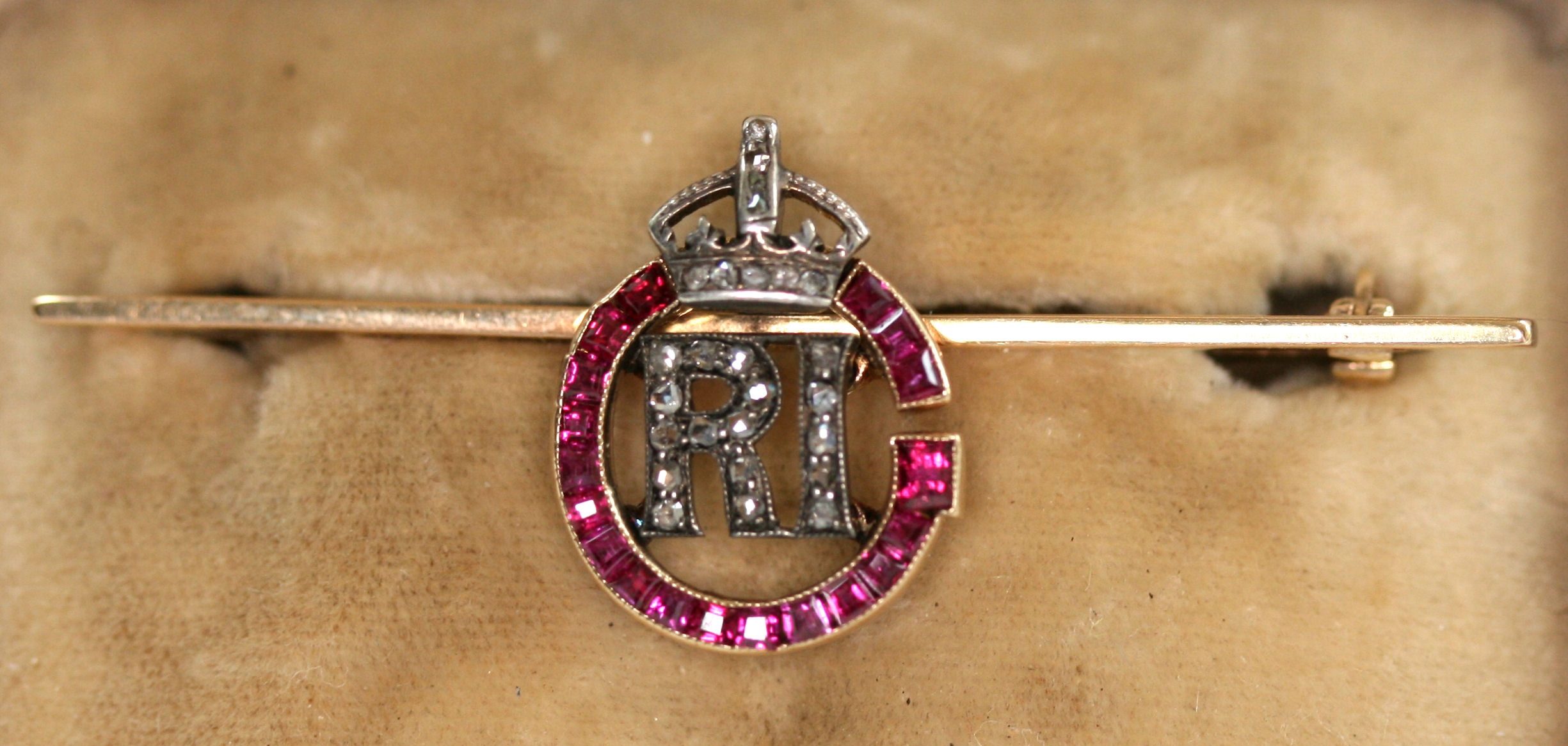 An Edwardian ruby and diamond set bar brooch
