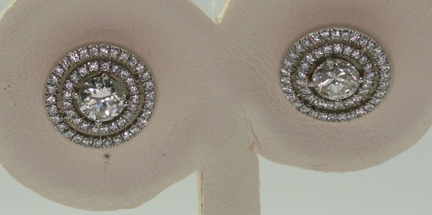 A pair of diamond cluster earrings,