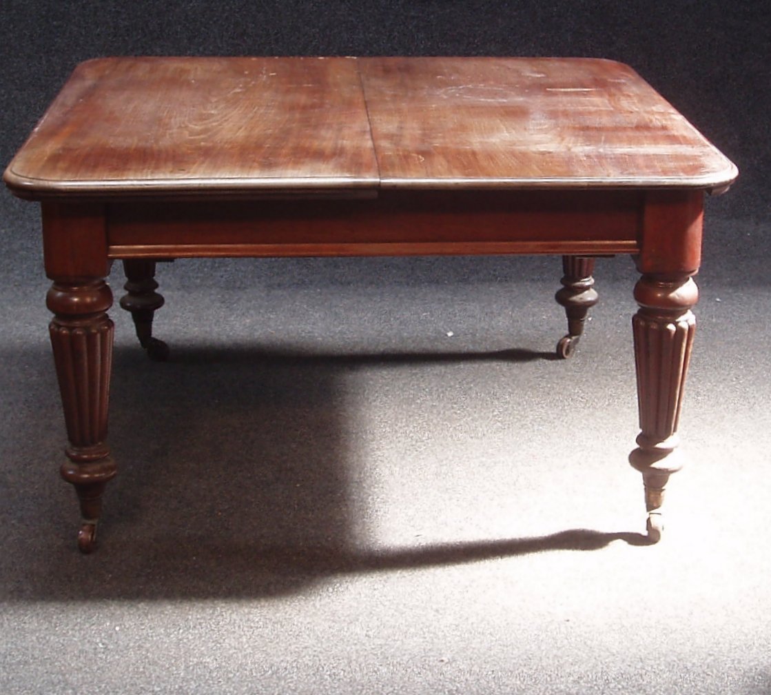 A Victorian mahogany extending dining table,