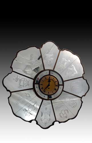 A 1930's mirrored Zodiac wall clock,