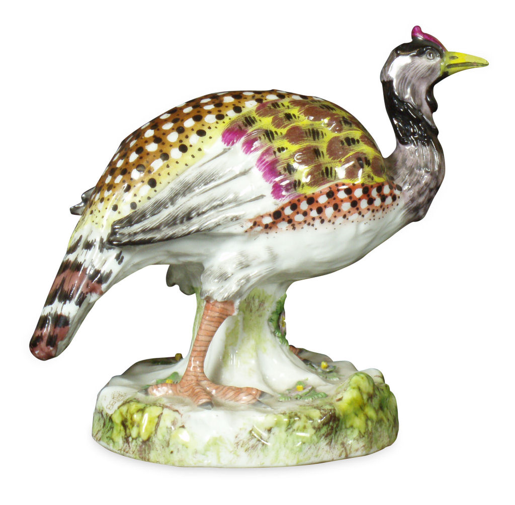 An early 19th century English porcelain figure of a peahen