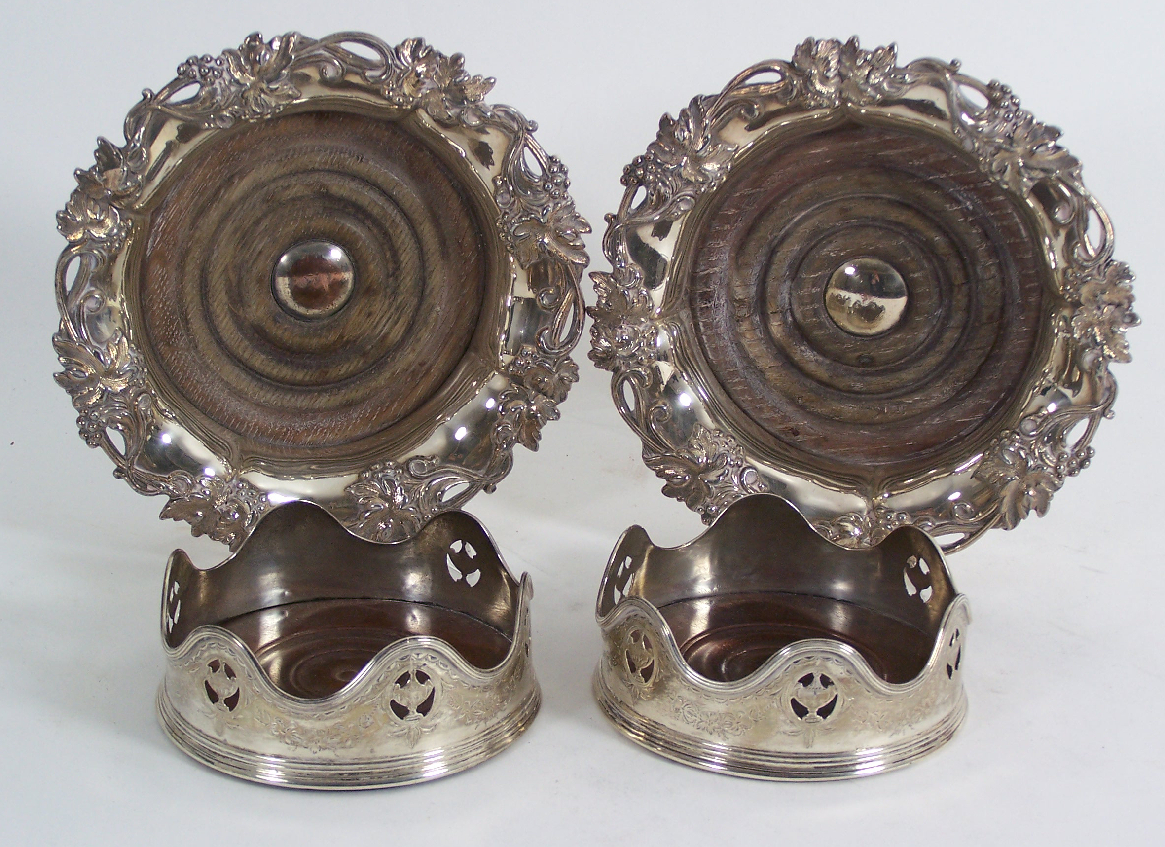 A pair of George III bottle coasters,