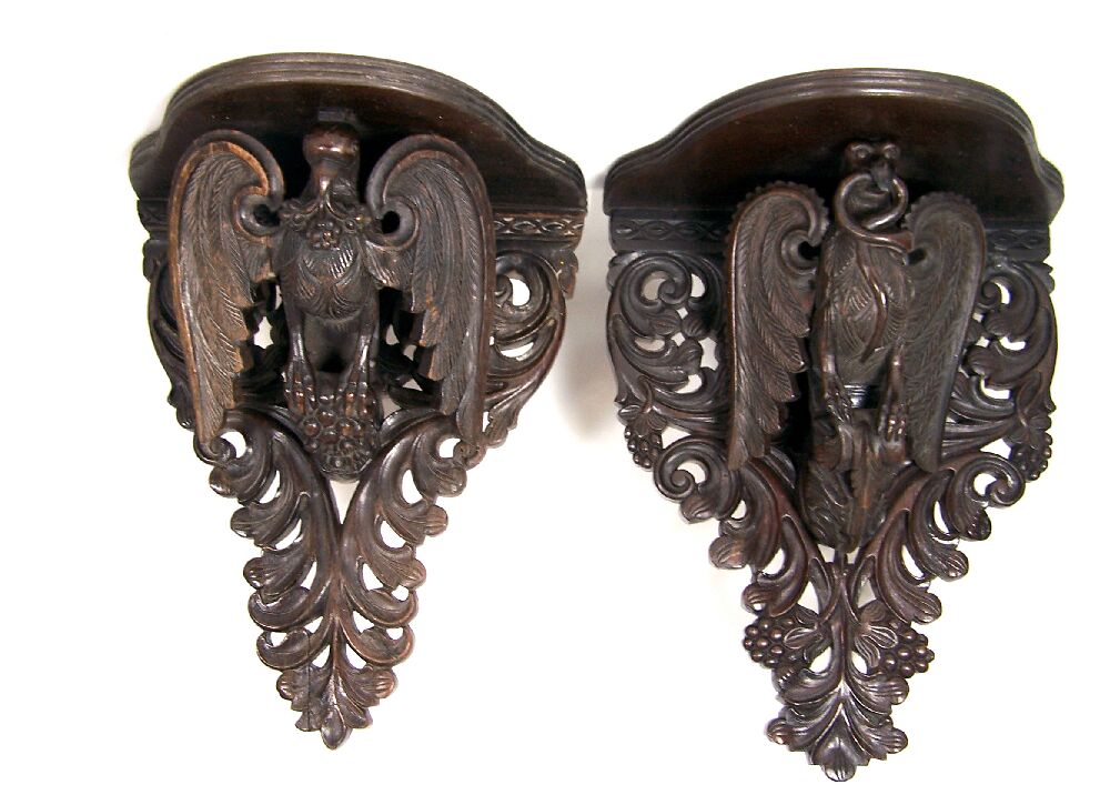 A pair of carved hardwood Anglo-Indian wall brackets