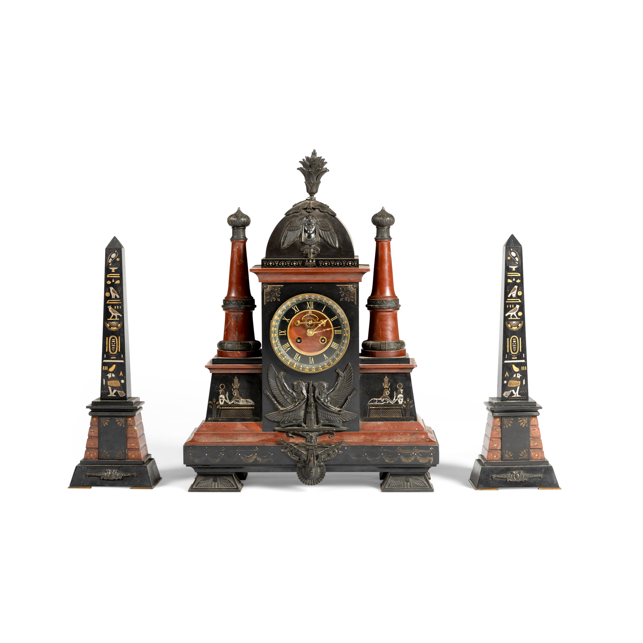 A RED MARBLE AND BLACK SLATE CLOCK GARNITURE