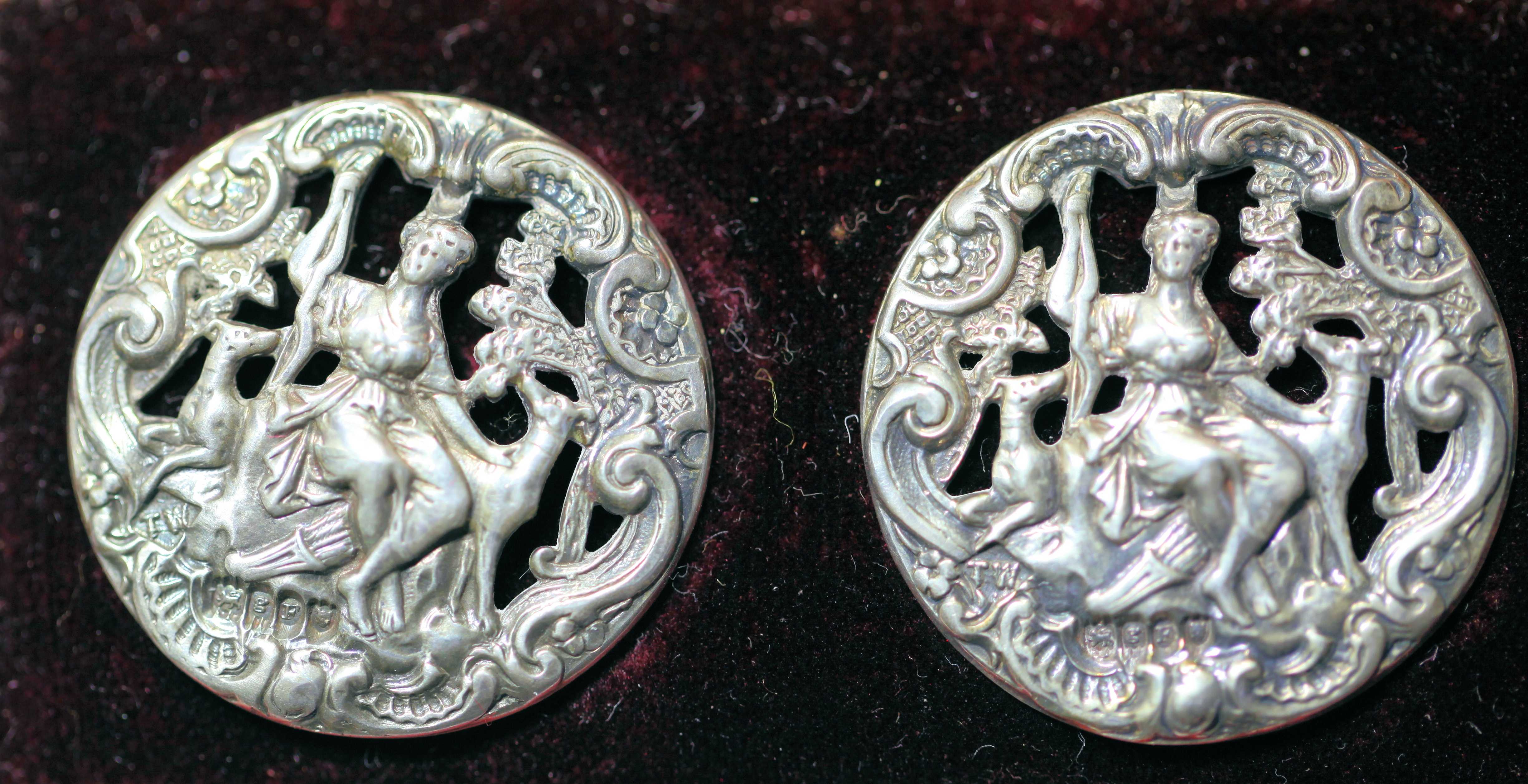 A cased set of six silver buttons