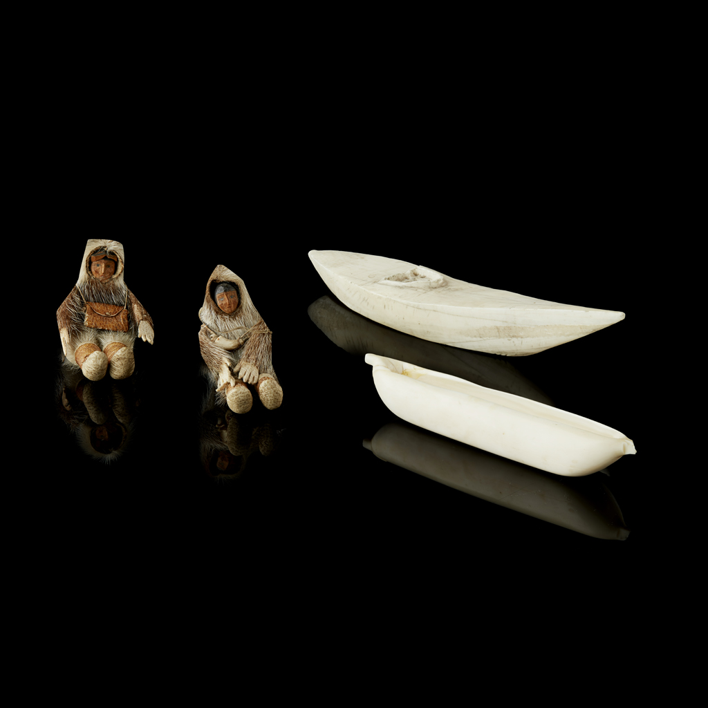 PAIR OF INUIT FIGURES AND CANOES