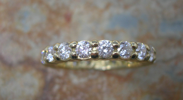 An 18ct gold mounted diamond full-eternity ring,