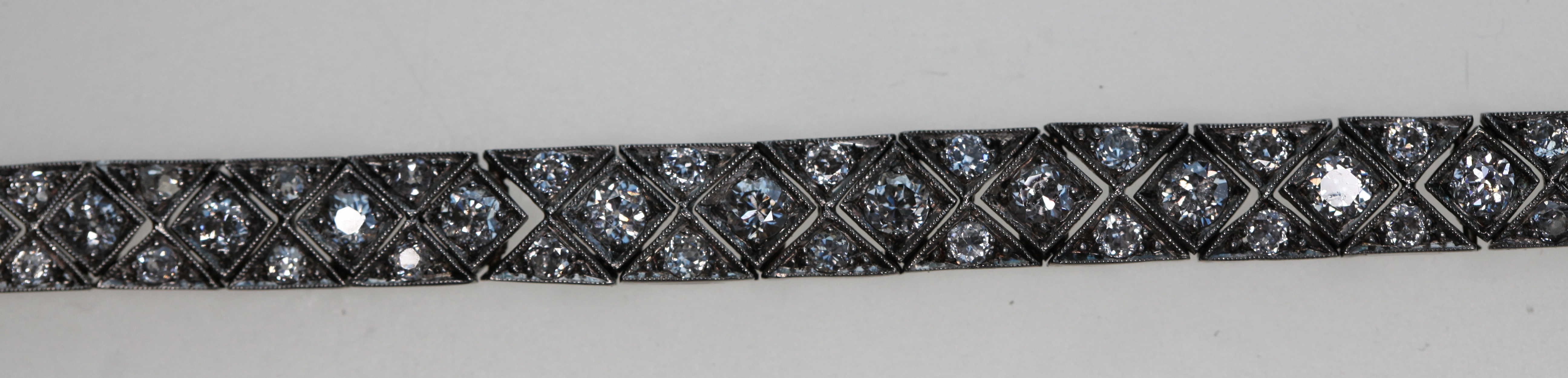 An Art Deco 18ct white gold and platinum mounted diamond set bracelet