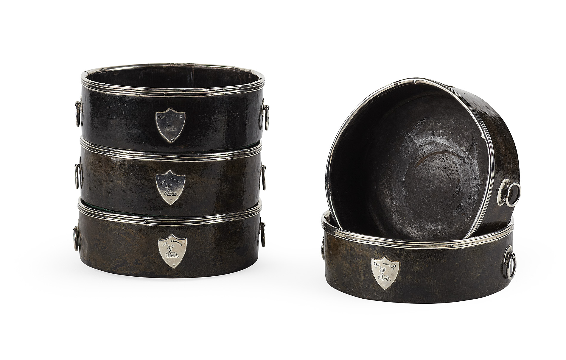 SET OF FIVE GEORGIAN SILVER MOUNTED LEATHER COASTERS