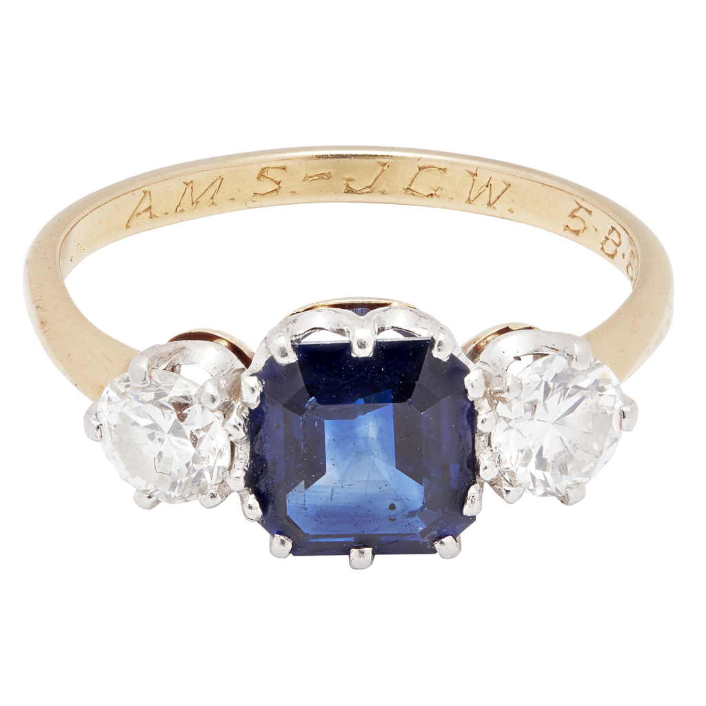 A three stone sapphire and diamond set ring