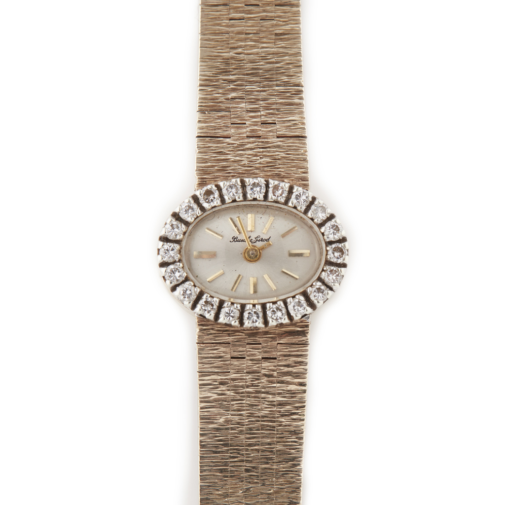 BUCHE-GIROD - A lady's 9ct gold diamond set wrist watch