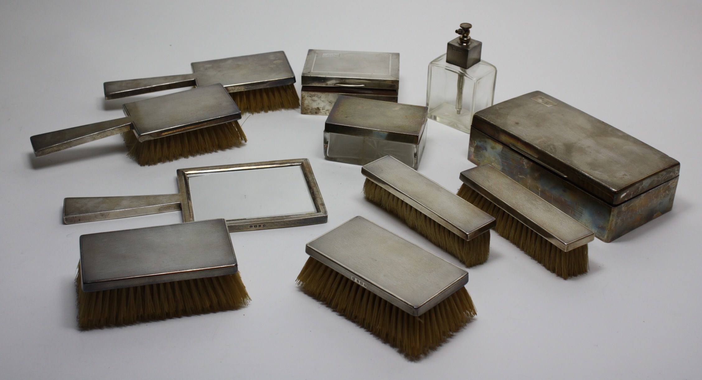 A matched engine turned dressing table set